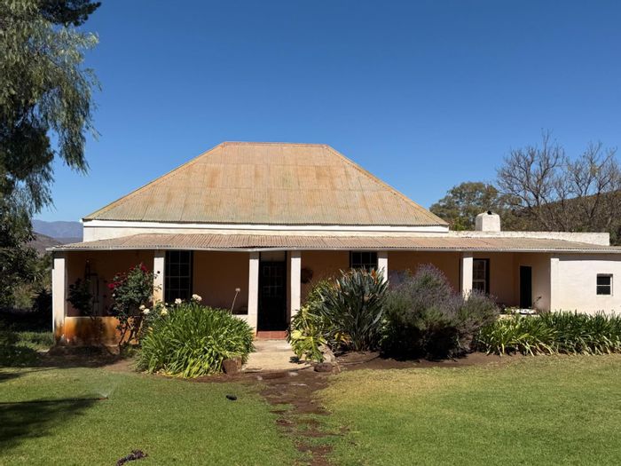 Farm for Sale in Van Wyksdorp: Ostrich and cattle farming, multiple homes, ample water.