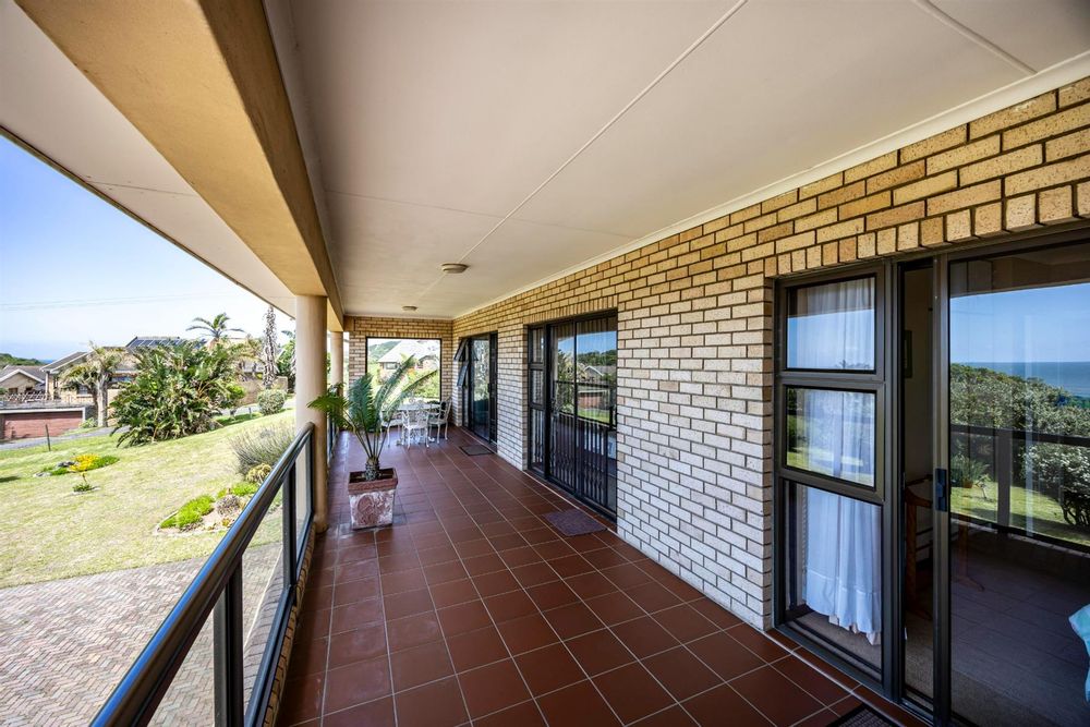 Covered verandah all three bedrooms leading out to