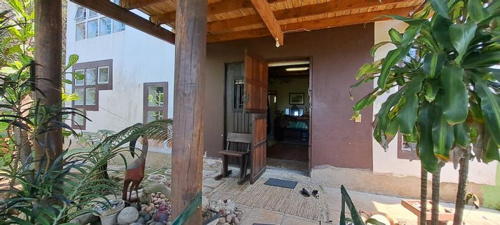 Palm Beach house for sale: 3 beds, 2 baths, spacious yard, renovation potential.