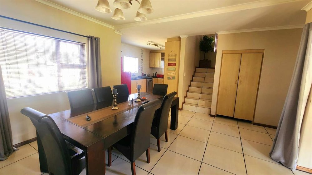 Open plan dining room and kitchen.