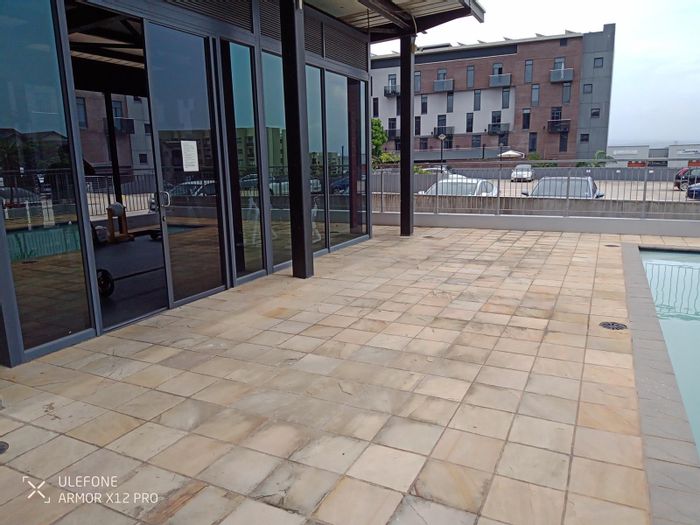 House To Rent in Umhlanga Central: Pool, gym, balcony, 24-hour security.