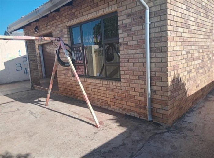 For Sale: 3 Bedroom House in Protea Glen with garage, back rooms, and gated yard.