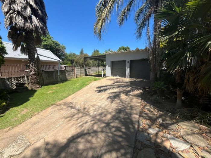 Dundee Central House For Sale: Spacious home with dual garages, flatlet, and lush yard.