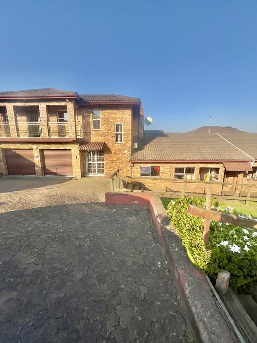 For Sale: House in Orient Heights with pool, gym, and spacious living areas.