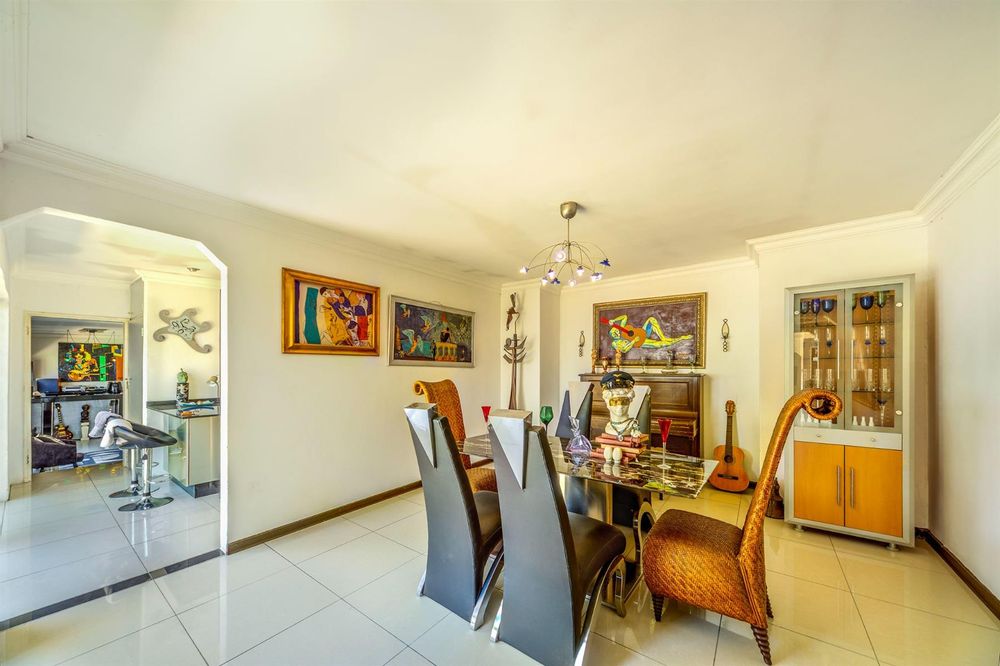 Dining room leading into kitchen