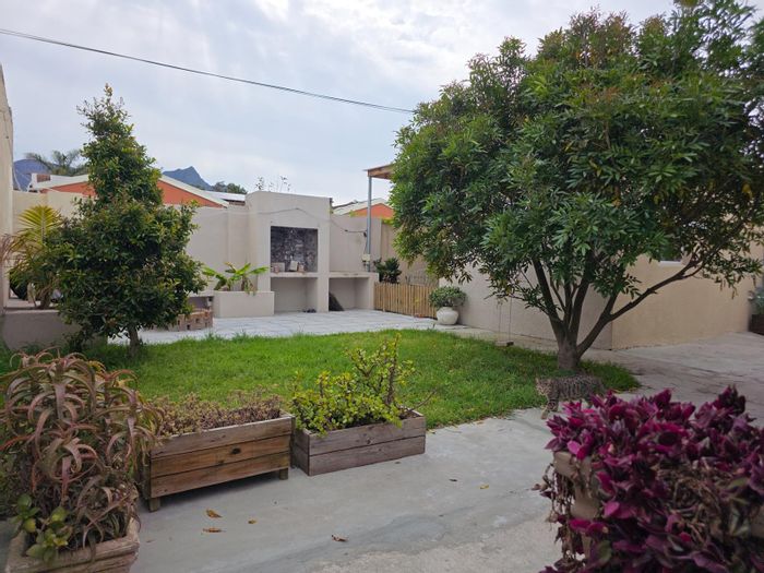 Rondebosch East House For Sale: Four rental units, secure parking, communal garden.