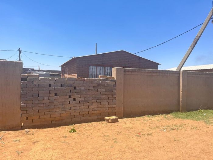 2-Bedroom House For Sale in Stretford with open-plan living and potential upgrades.