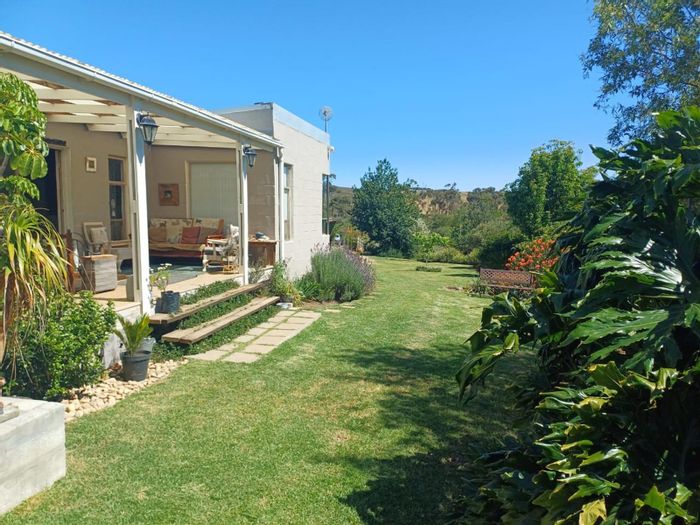 For Sale: 2-Bedroom House in Tesselaarsdal with Pool, Garden, and Solar System.