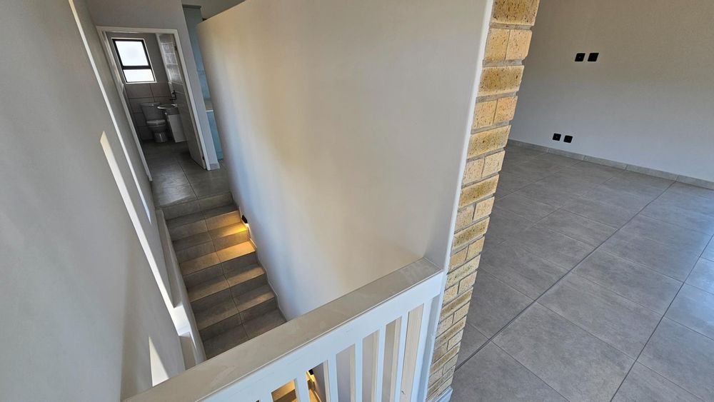 INTERIOR STAIRS AND GUEST TOILET