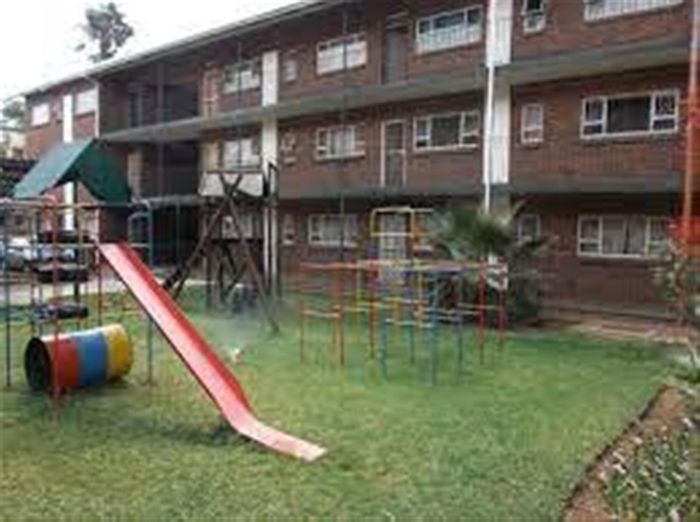 2-Bedroom Apartment For Sale in Booysens with parking and playground access.