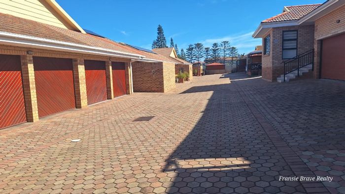 For Sale: 3-Bedroom Townhouse in Hartenbos Central with security, solar panels, and convenience.
