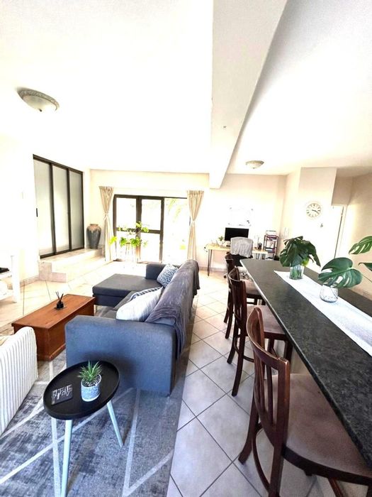 House to Rent in Calypso Beach: Open-plan living, garden access, beach nearby.