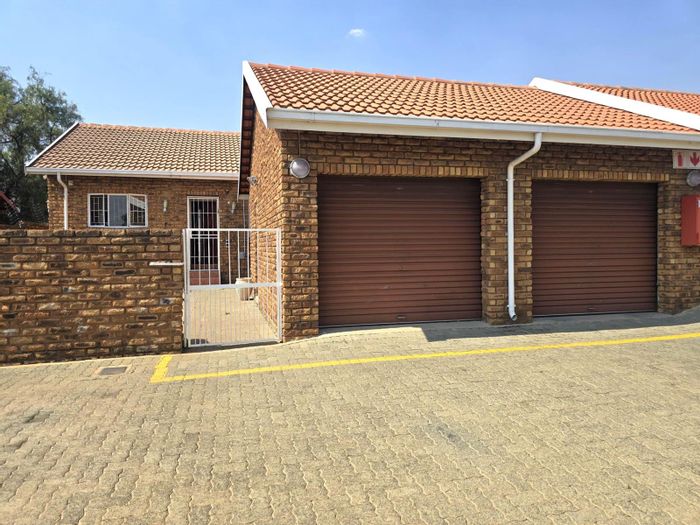 For Sale: Norkem Park Townhouse with 3 Beds, 2 Baths, and Private Courtyards.