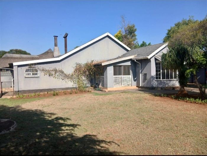 Spacious 4-bedroom house with cottage, pool, and entertainment area in Westonaria Central. For Sale.