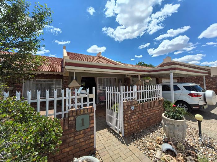 For Sale: Townhouse in Camelot with 3 beds, private garden, secure parking.