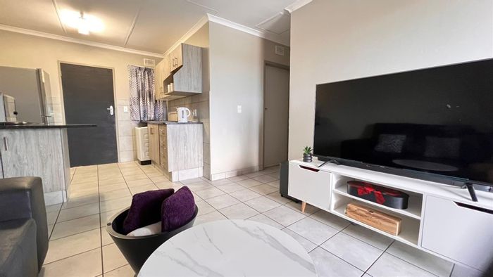 2-Bedroom Apartment For Sale in Heuweloord with security, balcony, and prime location.