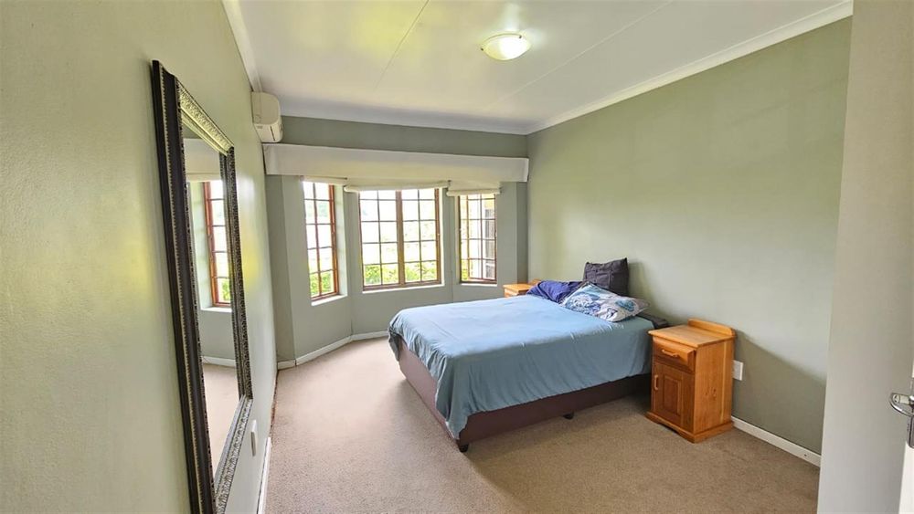big bedroom with bay windows
