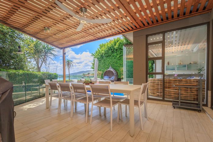 For Sale: Pecanwood House with waterfront views, solar system, and golf estate amenities.