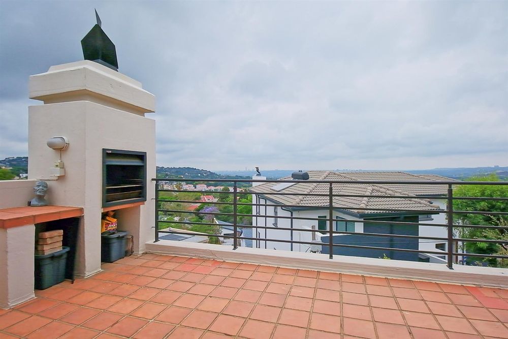 Spacious balcony with built-in braai