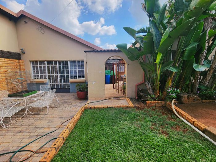 For Sale: Versatile dual-home in Valhalla with gardens, carports, and security features.