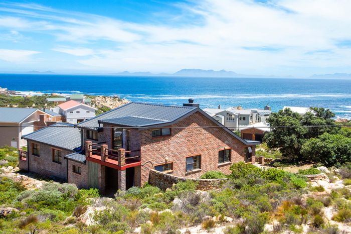 House for Sale in Rooi Els Central: Sea views, nature reserve, solar panels.