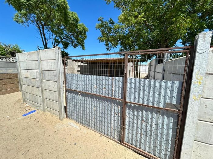 2-Bedroom House in Scottsdene For Sale with Large Yard and Renovation Potential.