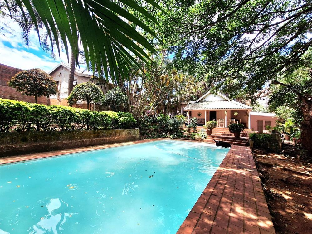 pool with house in the distance