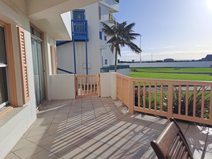 Coastal apartment for sale in Summerstrand with sea views and private verandah.