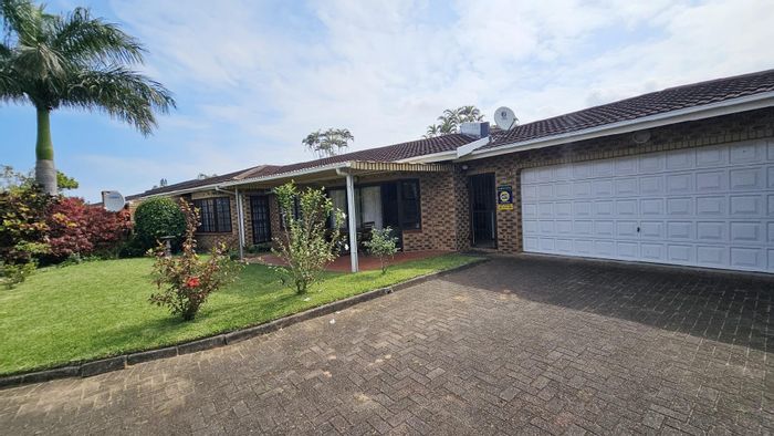 Spacious 3-bedroom townhouse in Uvongo Beach with garden, garage, and security. For Sale.