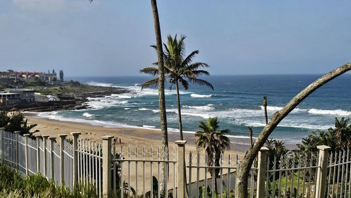 Beachfront Apartment For Sale in Uvongo Beach with direct access and amenities.