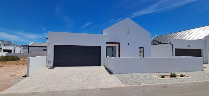 For Sale: House in Britannia Bay with 3 bedrooms, garage, and garden.