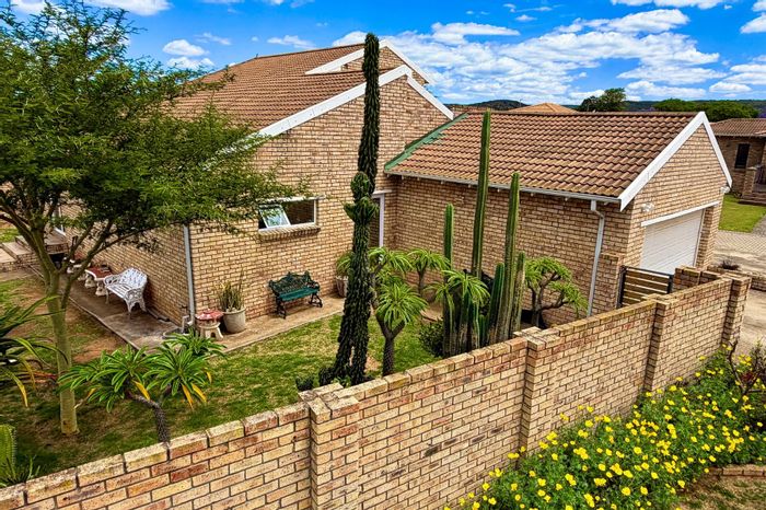 For Sale: Townhouse in Vanes Estate with secure yard, double garage, and private balcony.