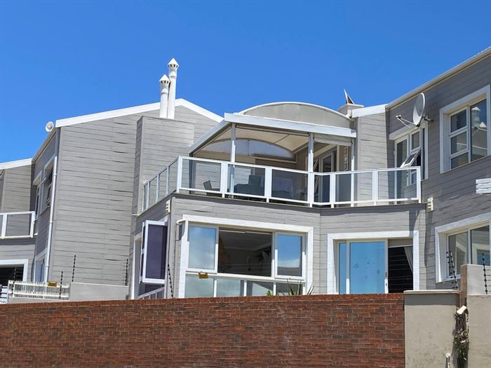 House for Sale in Ferreira Town: 3 Bedrooms, ocean views, open-plan living, patio.