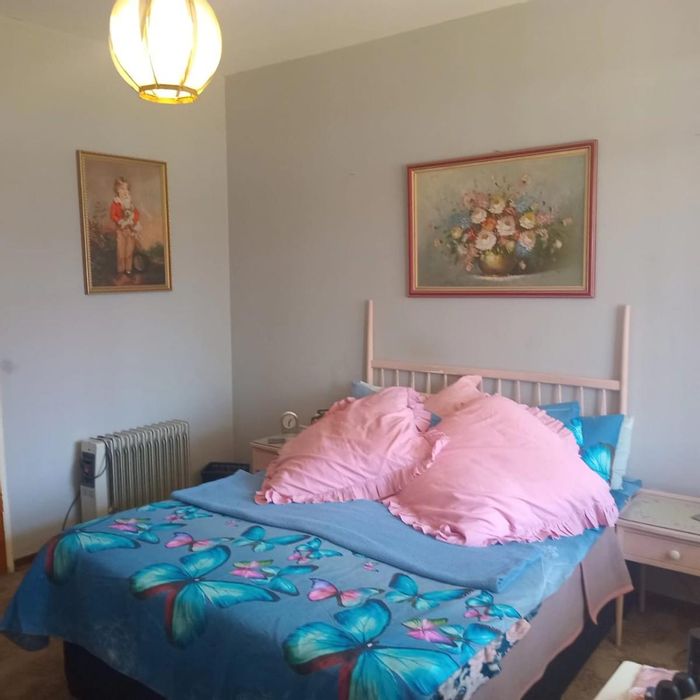 Apartment for sale in Benoni South with private yard, secure complex, and convenient transport.