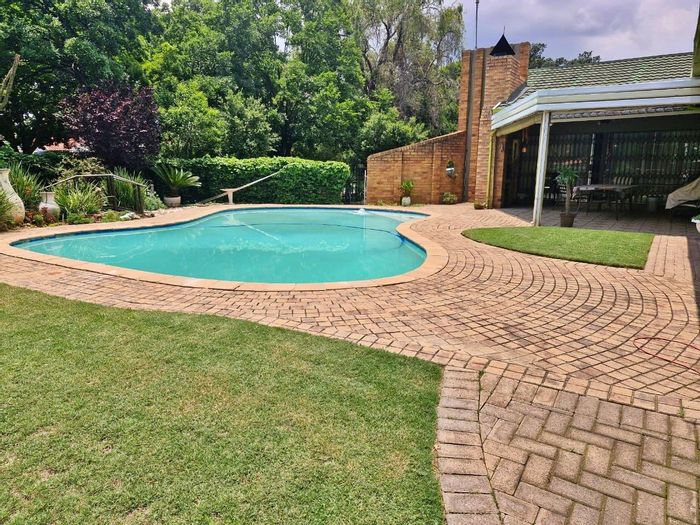 For Sale: House in Sasolburg Ext 23 with pool, garden, and security features.
