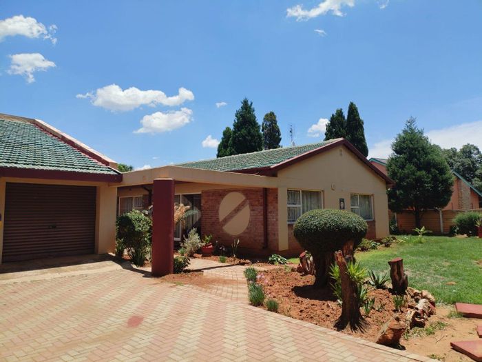 Spacious 4-bedroom house with pool, lapa, and study in Stilfontein Central For Sale.