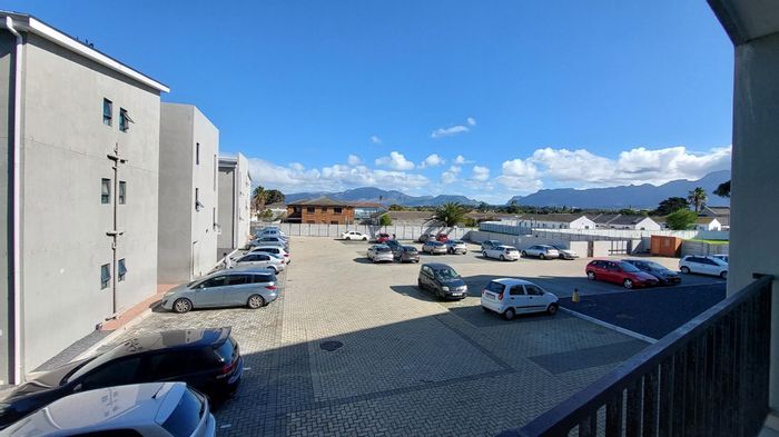 2-Bedroom Apartment For Sale in Ottery with balcony, parking, and security features.