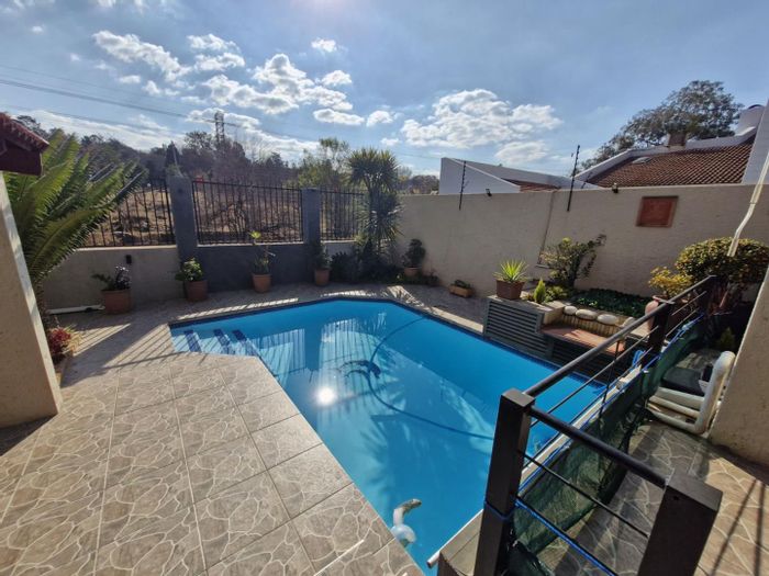 For Sale: Bryanston House with pool, double garages, staff quarters, and solar.