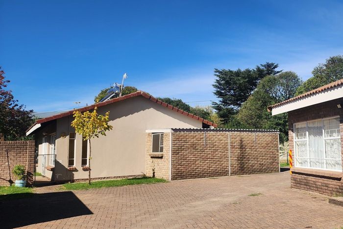For Sale: House in Harrismith Central with 11 apartments, garden, and playground.