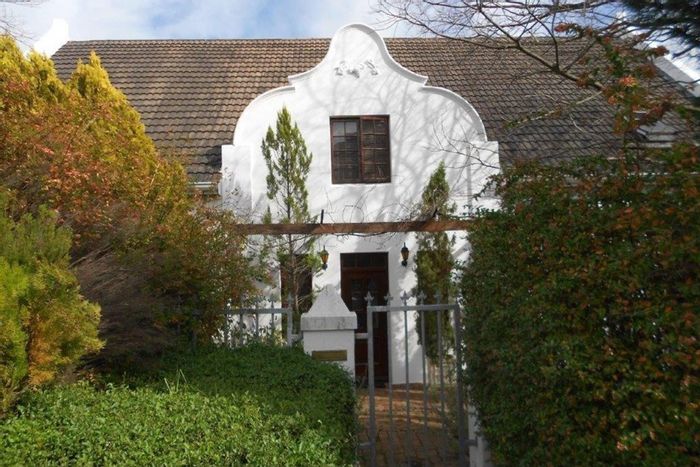 Commercial Guest House For Sale in Franschhoek Central with 7 rooms, pool, and parking.
