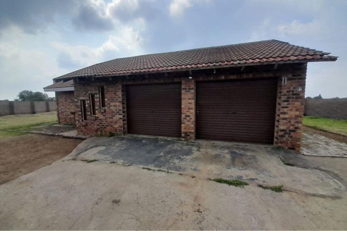 Farm For Sale in Deneysville Central: Spacious land, double garage, and serene surroundings.