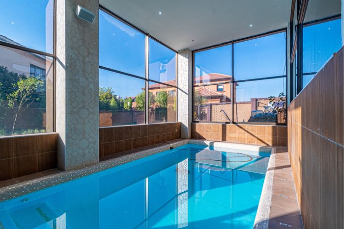 For Sale: House in Blue Valley Golf Estate with indoor pool, cinema, and solar power.