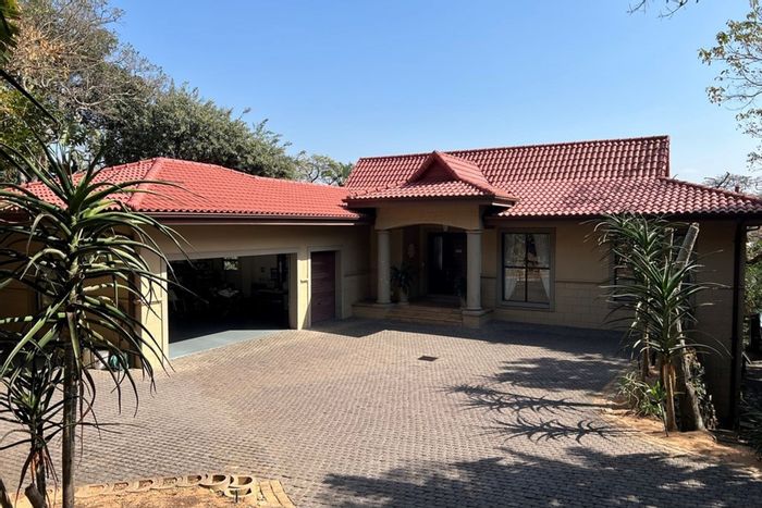 For Sale: House in Zimbali with 4 bedrooms, pool, office, and golf cart garage.
