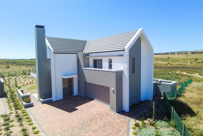 For Sale: House in Langebaan Country Estate with golf course access and greenbelt views.