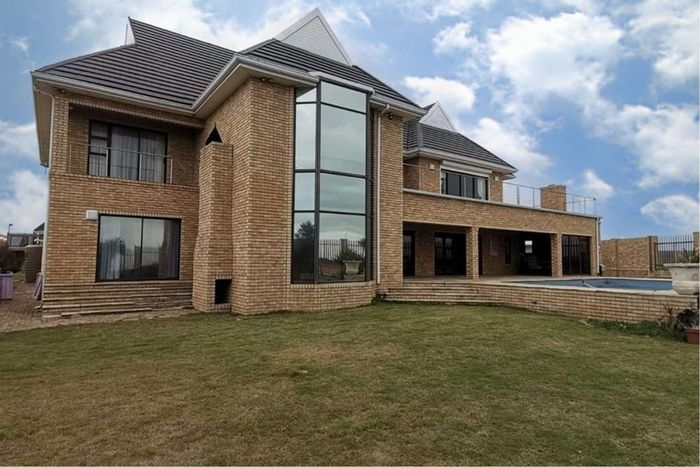 For Sale: 5-bedroom house in Bluewater Bay with pool, gardens, and security features.