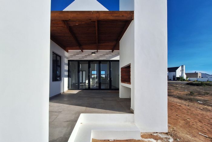 Coastal house for sale in Britannia Bay with beach access and outdoor entertaining.