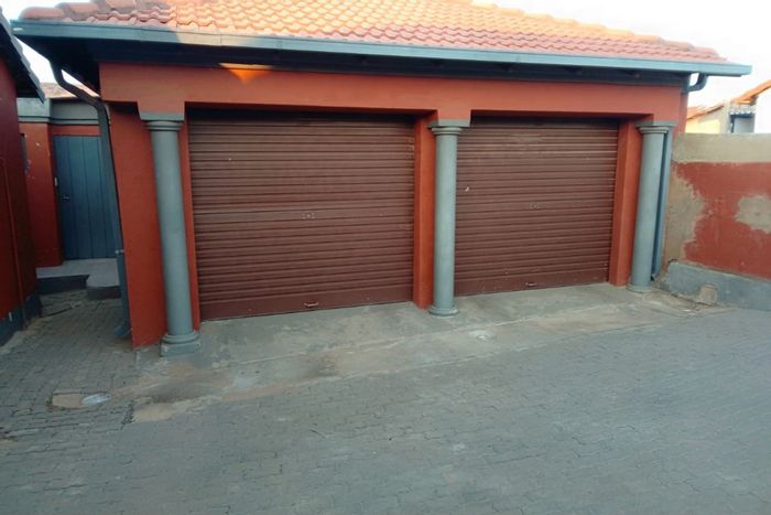 For Sale: Spacious 3-bedroom house in Mahube Valley with garages and outdoor privacy.