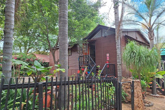 Unique 3-Bedroom Log Home in Kranspoort with Pool, Braai Room, and Wildlife Access. For Sale.