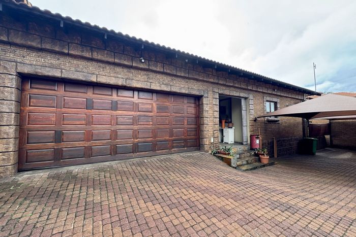 Aerorand House For Sale: Open-plan living, indoor braai, secure garden, double garage.