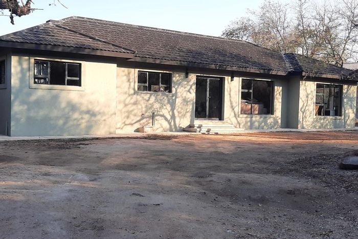 House for Sale in Marloth Park Central: 3 beds, pool, open-plan living, secure parking.